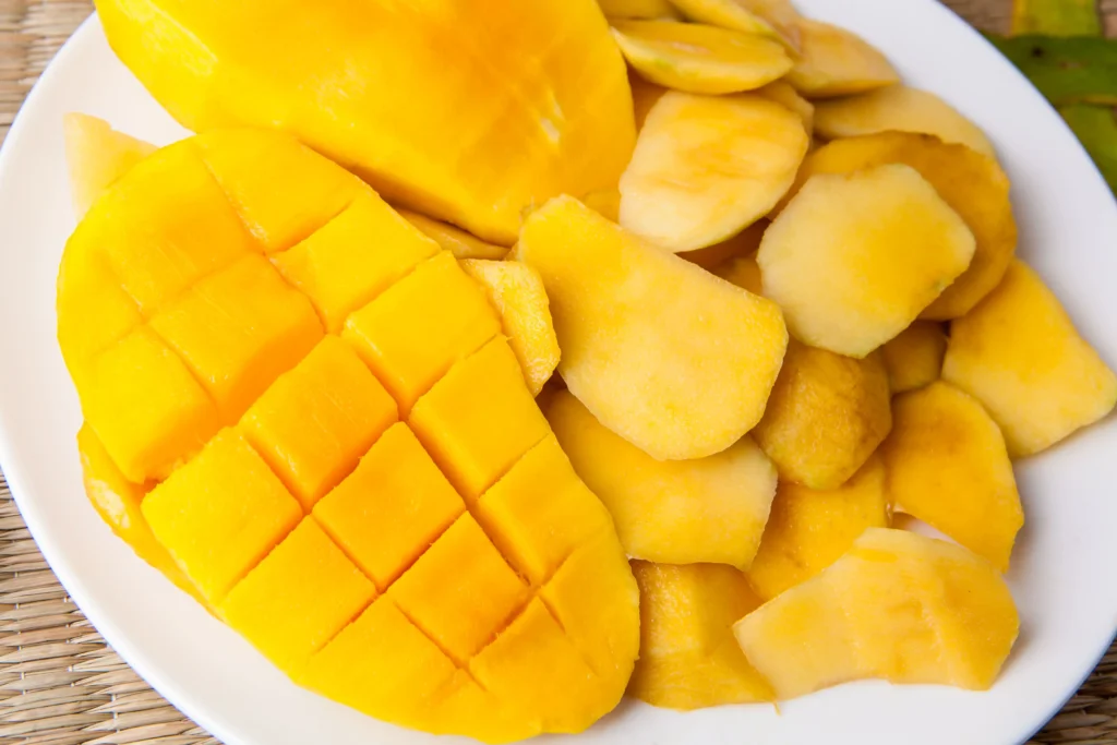 Yellow Sliced Fruit On White Plate